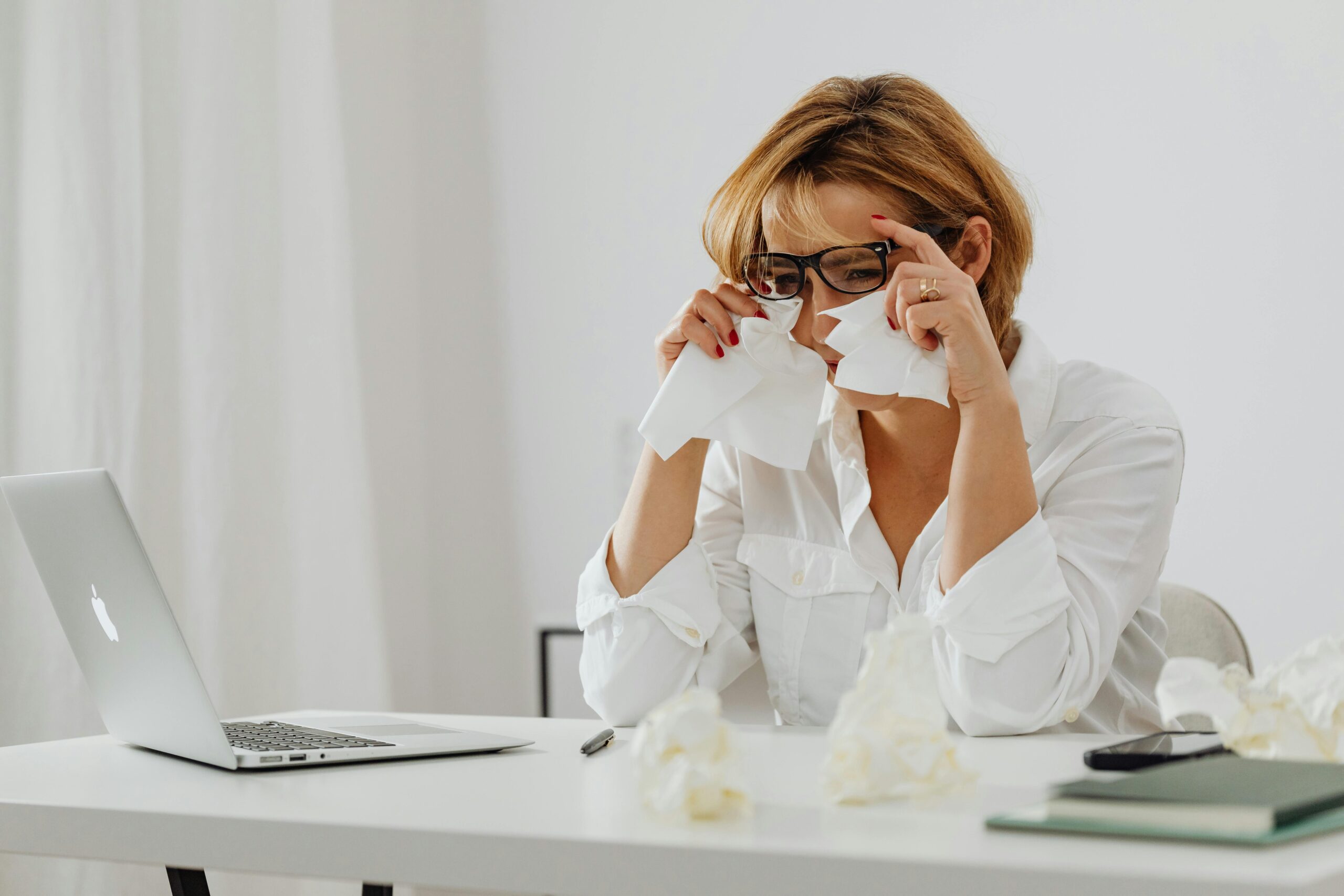 A Sad Woman Wiping Her Tears with Tissue